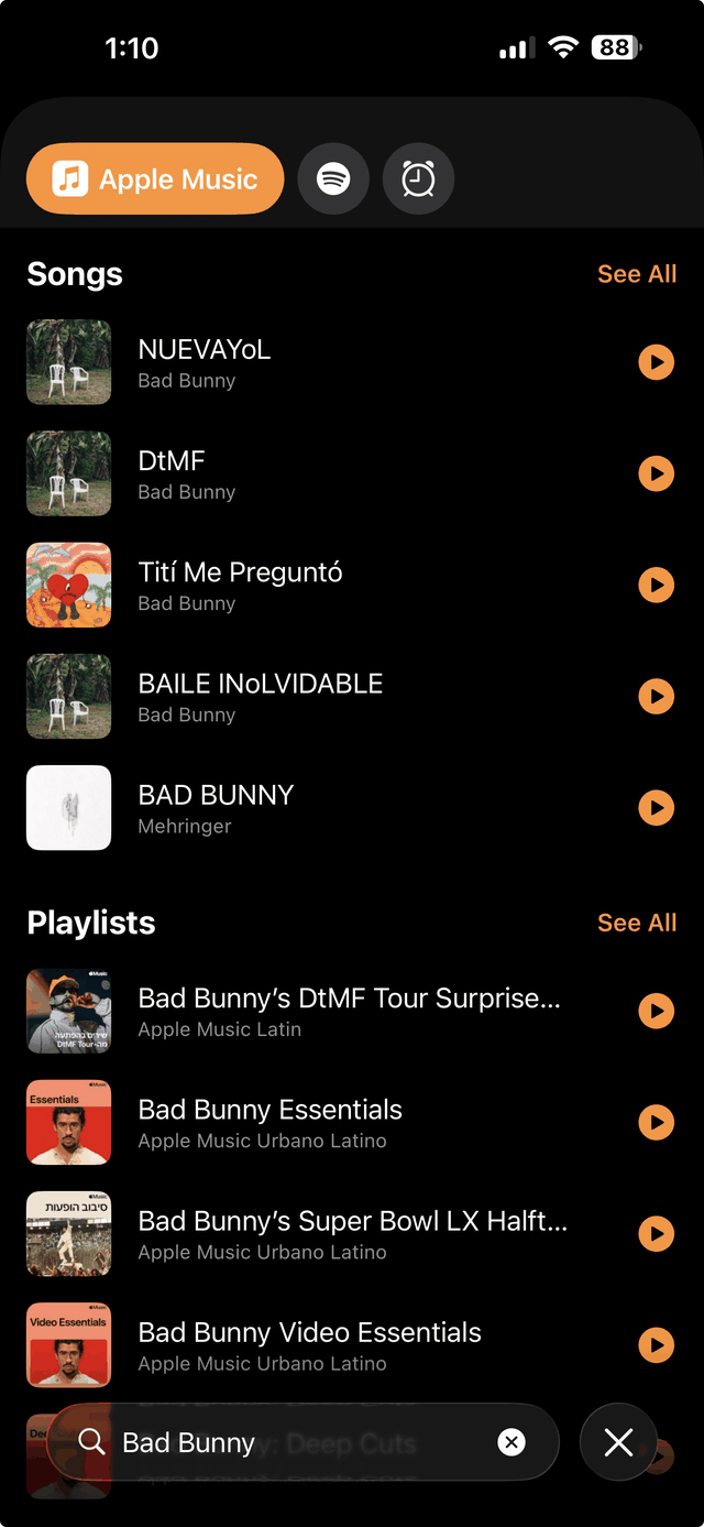Wakeify's music picker on iPhone. Tabs across the top switch between Apple Music, Spotify and Tones. A Songs section lists tracks by Bad Bunny and a Playlists section lists Apple Music playlists, each row with an orange play button to hear it. A search field at the bottom contains the words Bad Bunny.